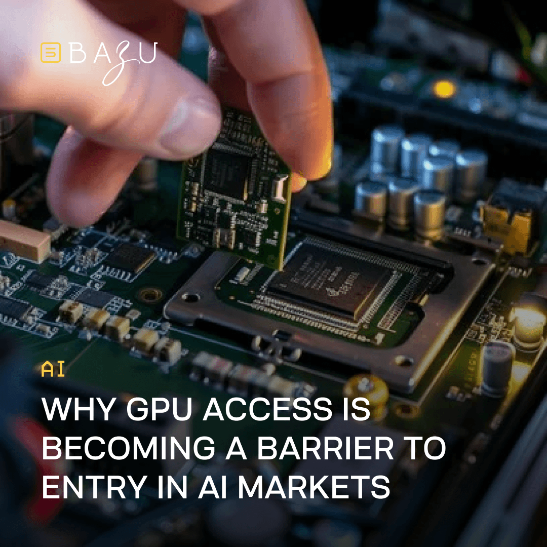 Close-up of a technician's hand carefully holding a small green GPU or AI accelerator chip above an open motherboard densely populated with electronic components, capacitors, and sockets under warm ambient lighting, overlaid with the BAZU logo and bold text explaining why GPU access is becoming a significant barrier to entry in AI markets.